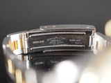 a close up of a watch on a table