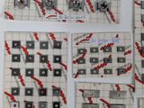 four pieces of paper that have been made to look like a chess game