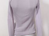 the back view of a mannequin wearing a purple sweater