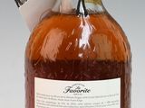 a bottle of liquor sitting on a white surface