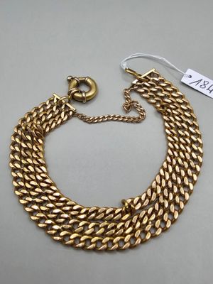 an image of a gold chain bracelet with a clasp
