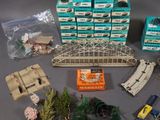 a lot of toy train tracks and other items on the table