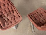 pair of mid - century modern lounge chairs and foot stools in velvet upholstered