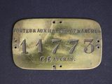 a brass plate with the name of a person who is riding a horse