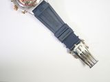 an image of a watch with a blue strap on a white surface