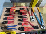many different types of pliers and tools on the table