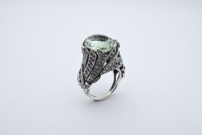a green tourmaline and diamond ring set in silver