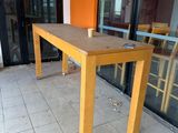 a table that is sitting outside of a building