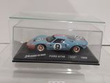 a close up of a toy car in a clear display case