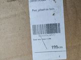 a box with a price tag on it sitting on the floor