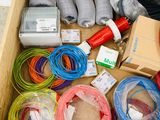 a wooden box filled with assorted wires and wires