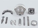 a lot of silver items that are on the table