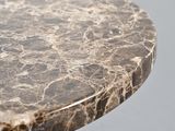 a close up of a marble table top on a gray surface