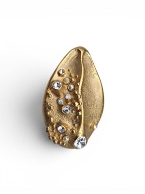 a close up of a gold ring on a white background