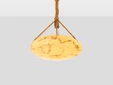 a close up of a light fixture on a white wall