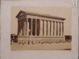 an old picture of a large building with columns