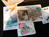 a lot of cards and postcards on a table