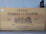 a wooden box that has a bottle of wine in it