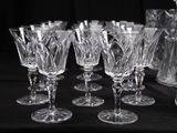 a lot of wine glasses sitting on a table