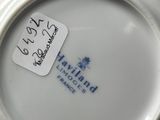 a close up of a plate with a sticker on it