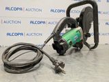 a close up of a machine on a table with a hose