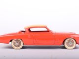 toy car on a white surface with a white background