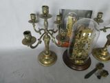 a glass dome with a clock inside of it on a table