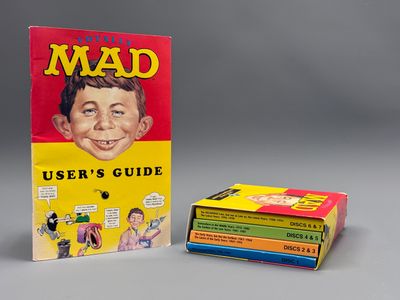 a box of books with a picture of a man on the cover