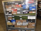 a metal cart with many boxes on it in a warehouse