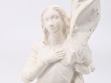 a white statue of a woman holding a large umbrella