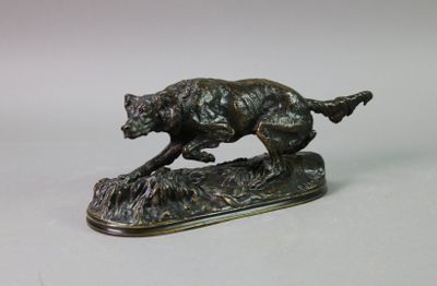 bronze statue of a dog running on a rock on a white background