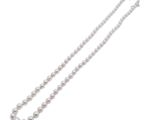 a close up of a white pearl necklace on a white background