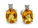 une paire de boucles d'oreilles en saphir jaune et diamants
