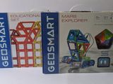 boxes of educational toys for kids on a white surface