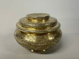 brass plated box with lid and lid covered with a decorative design