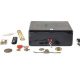 a black box with keys, keys, keys, and other items on it