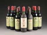several bottles of wine are lined up in a row