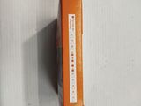 an orange box that is on a white surface