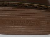 brown leather shoe with brown stitching on the bottom of the shoe