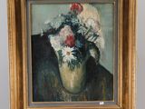 une peinture de fleurs dans un vase sur un chevalet