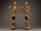 pair of antique brass candelabs with black and white marble vases