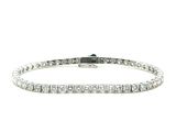 a diamond tennis bracelet on a white background