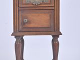 a small wooden table with a drawer on top of it
