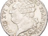 gros plan d'une pièce de monnaie sur laquelle figure un visage de femme