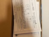 a box with a lot of papers and a laptop in it