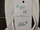 a white dress with a tag on it hanging from a hanger