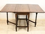 a wooden table with two legs and a wooden table top