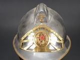a silver helmet with a red star on it
