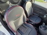 two seats in the back of a car with red trims