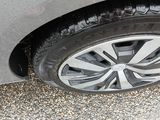 a close up of a car ' s tire on the road